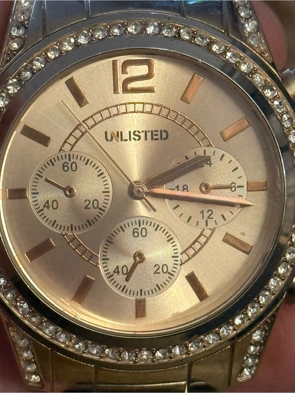 Unlisted by Kenneth Cole gold stainless steel crystal bezel watch